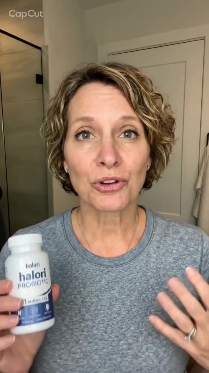Halori customer holding the Oral Probiotic bottle
